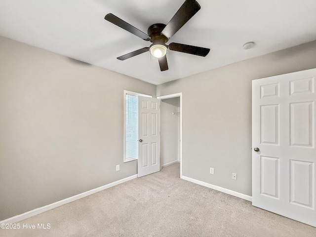 unfurnished bedroom with light carpet and ceiling fan