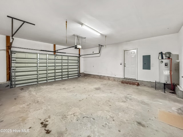 garage featuring a garage door opener, electric panel, and electric water heater