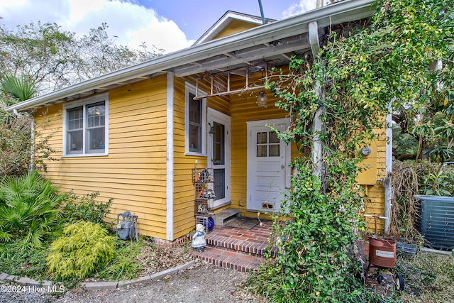 doorway to property with cooling unit