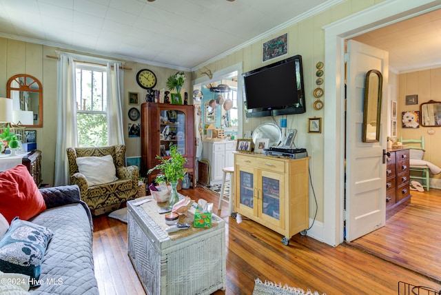 living room featuring ornamental molding and hardwood / wood-style floors