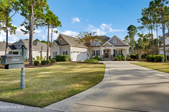 view of front of house featuring a garage and a front yard