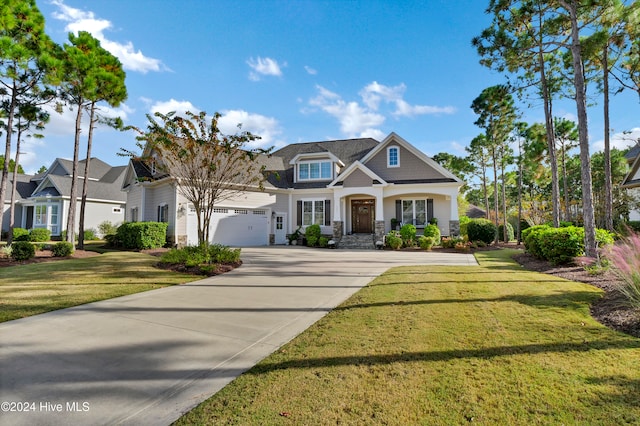 view of front of home with a front lawn and a garage