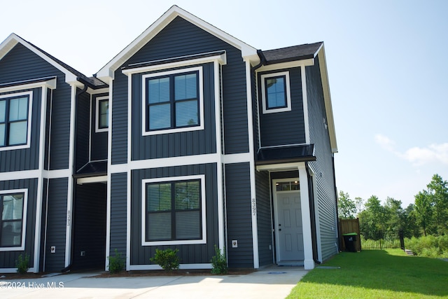 townhome / multi-family property featuring board and batten siding