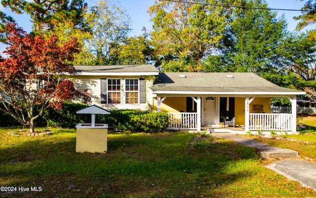 view of front of house featuring a front lawn and a porch