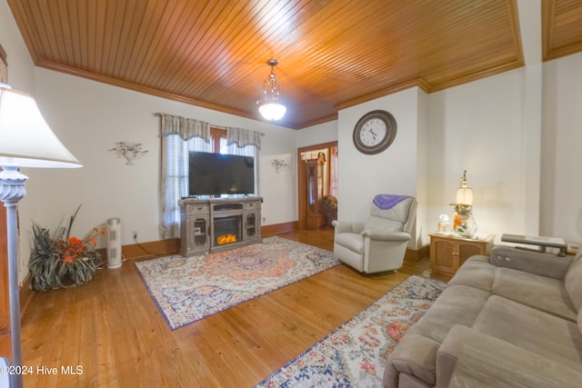 living room featuring wood-type flooring, wood ceiling, and crown molding