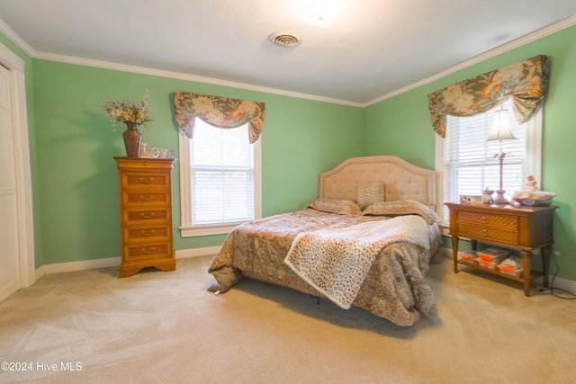 bedroom featuring crown molding and carpet floors