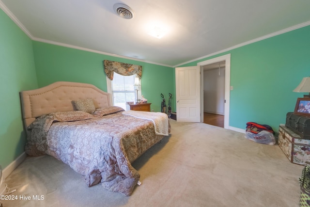 bedroom with carpet and crown molding