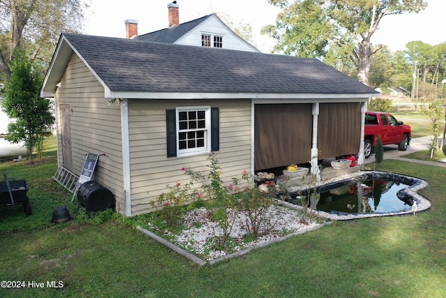 view of property exterior with a lawn