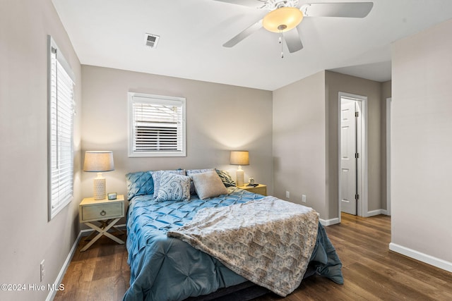 bedroom featuring ceiling fan and dark hardwood / wood-style floors