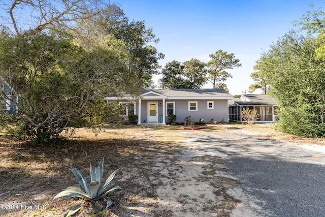 single story home with a sunroom