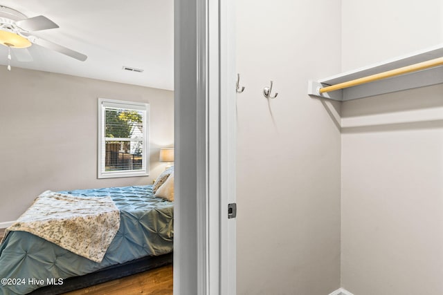 bedroom featuring ceiling fan and hardwood / wood-style flooring