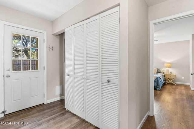 entryway with dark hardwood / wood-style floors