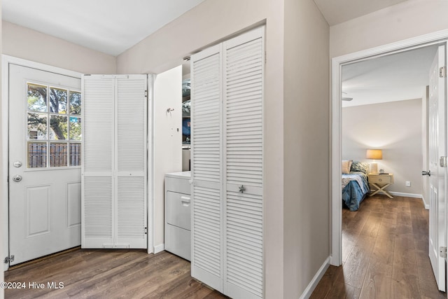 interior space featuring dark wood-type flooring and washer / dryer