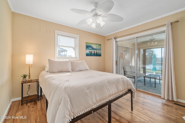 bedroom with access to exterior, light hardwood / wood-style flooring, ornamental molding, and ceiling fan