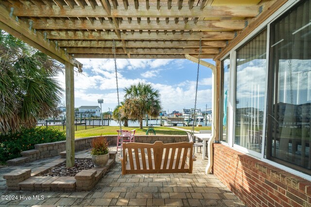 view of patio with a water view