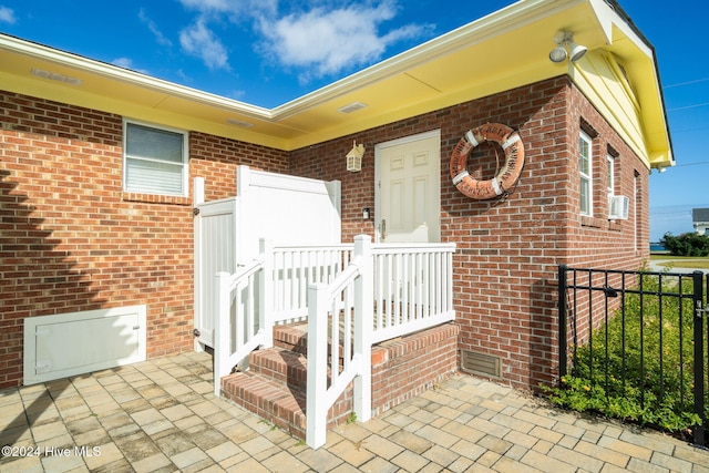 entrance to property with a patio