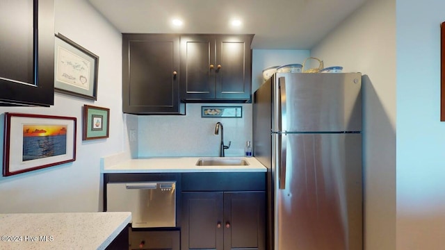 kitchen with sink and appliances with stainless steel finishes