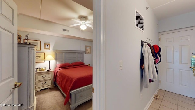 bedroom with light tile patterned floors and ceiling fan