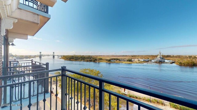 balcony featuring a water view