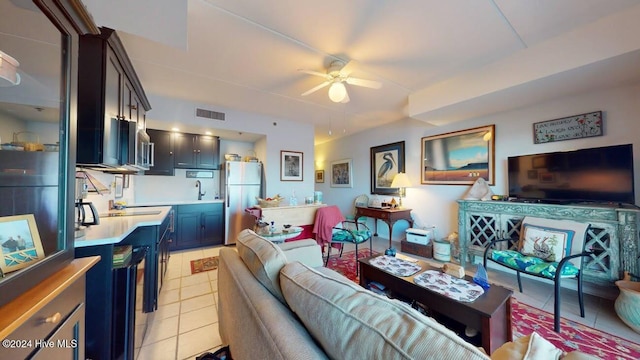 bedroom featuring light tile patterned floors and ceiling fan