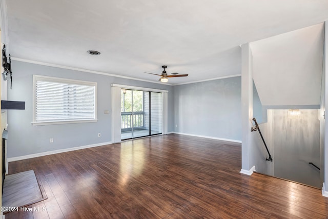 unfurnished living room with crown molding, dark hardwood / wood-style floors, and ceiling fan