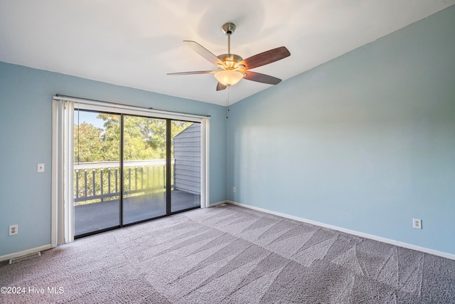 unfurnished room with lofted ceiling, light colored carpet, and ceiling fan