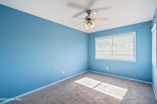 unfurnished room featuring carpet floors and ceiling fan