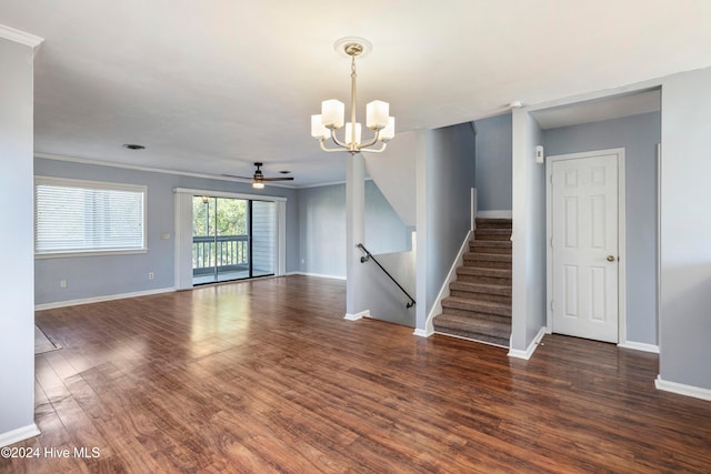 interior space featuring crown molding, ceiling fan with notable chandelier, and dark hardwood / wood-style flooring