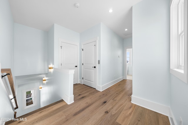 hallway with light wood-type flooring