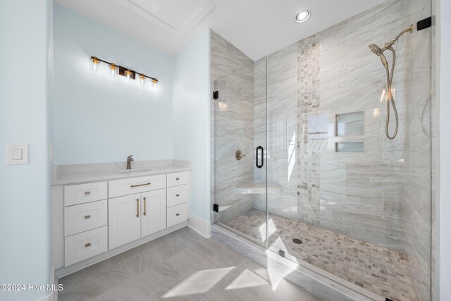 1405 Pinfish Ln, Carolina Beach, NC 28428 - full bath with a stall shower, marble finish flooring, vanity, and recessed lighting