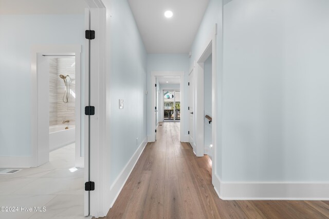 1405 Pinfish Ln, Carolina Beach, NC 28428 - hall with baseboards, light wood-style floors, and recessed lighting