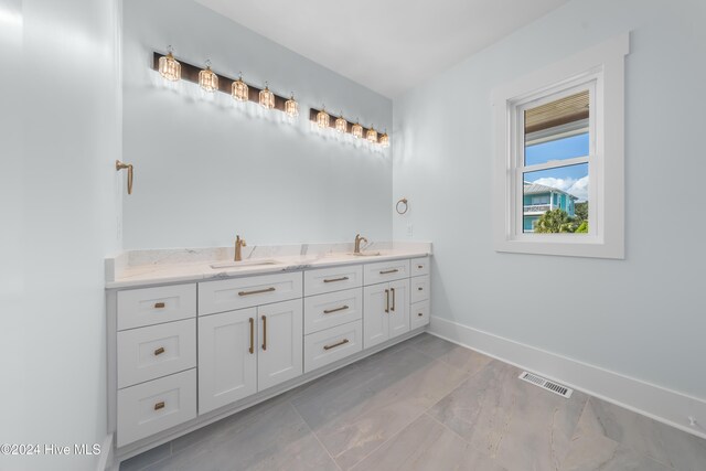 1405 Pinfish Ln, Carolina Beach, NC 28428 - full bath featuring double vanity and baseboards