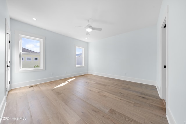 unfurnished room featuring light hardwood / wood-style floors and ceiling fan