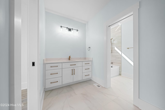 bathroom featuring vanity and  shower combination