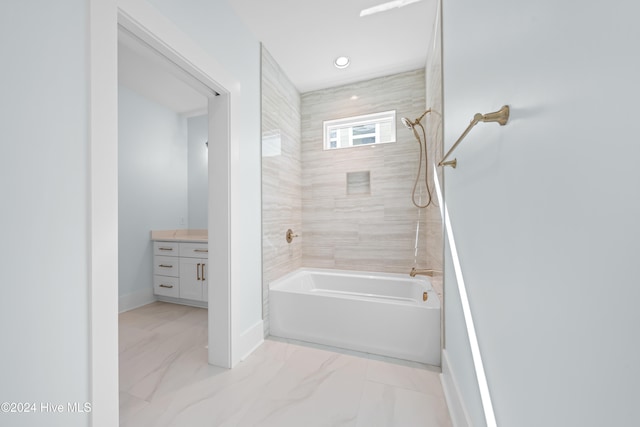 bathroom with vanity and tiled shower / bath combo