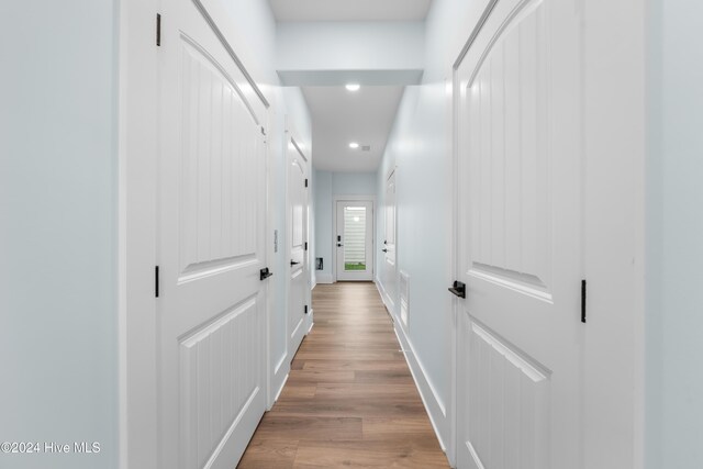 1405 Pinfish Ln, Carolina Beach, NC 28428 - hall with recessed lighting, light wood-style flooring, and baseboards
