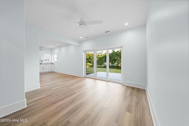 1405 Pinfish Ln, Carolina Beach, NC 28428 - spare room with a ceiling fan, light wood finished floors, baseboards, recessed lighting, and a sink