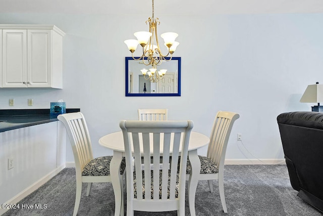 carpeted dining area featuring a notable chandelier