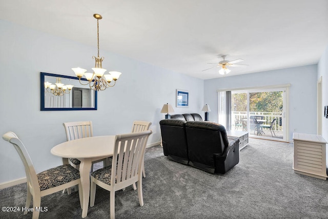 dining room with ceiling fan with notable chandelier and dark carpet