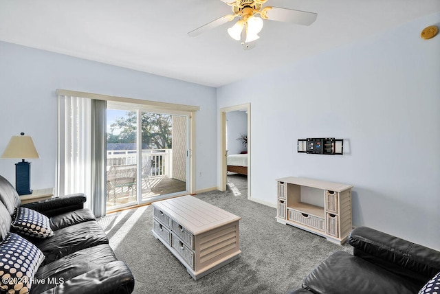 carpeted living room featuring ceiling fan