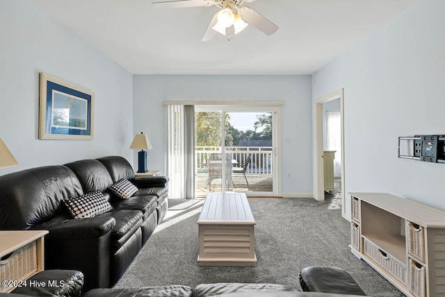 carpeted living room featuring ceiling fan