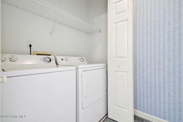 laundry area with independent washer and dryer