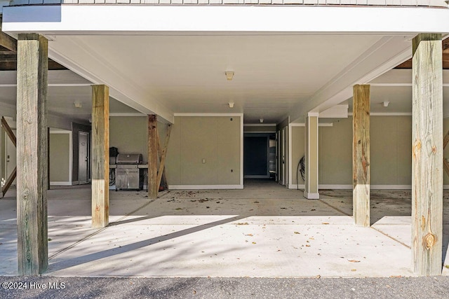 view of patio / terrace with area for grilling and a carport