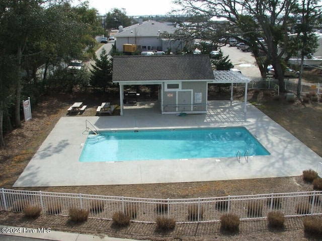 view of swimming pool with a patio