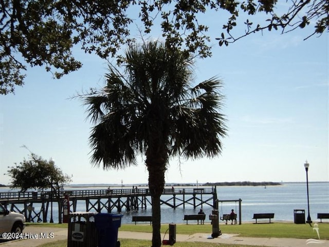 exterior space with a lawn and a water view