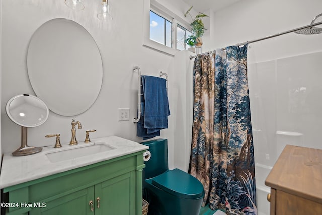 bathroom featuring shower / bath combo with shower curtain and vanity