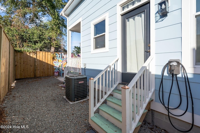 doorway to property featuring central AC