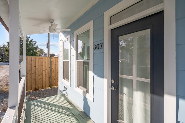 exterior space with covered porch and ceiling fan