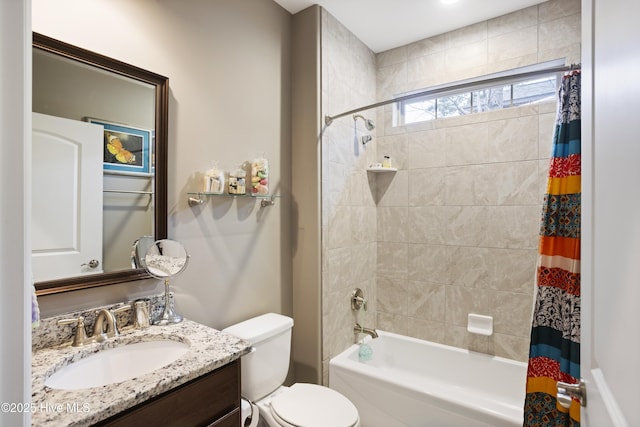 full bathroom with vanity, toilet, and shower / bath combo with shower curtain