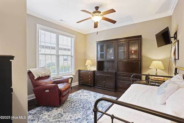 bedroom featuring ceiling fan, crown molding, and dark hardwood / wood-style floors